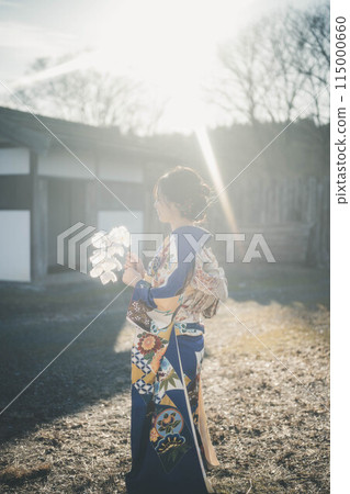A young woman in Japanese clothing with blue sky 115000660