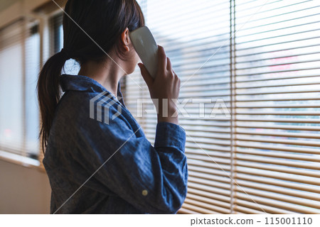 A woman making a phone call 115001110