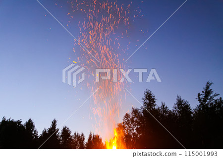 Bonfire outdoors at night. 115001993