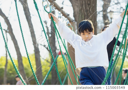 Kids playing happily in the park Kids playing happily in the park 115003549