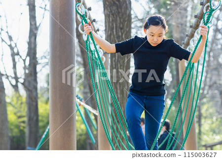 Elementary school girls enjoying athletics Elementary school girls enjoying athletics 115003627