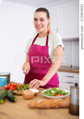 Housewife preparing food at home 115004681