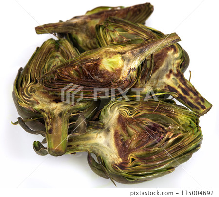 Cooked fried halves artichokes on white plate Cooked fried halves artichokes on white plate 115004692