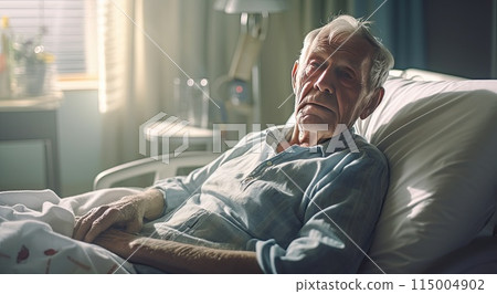 Elderly man laying in hospital bed 115004902
