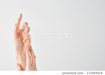 Woman's hands and white background Woman's hands and white background 115004929