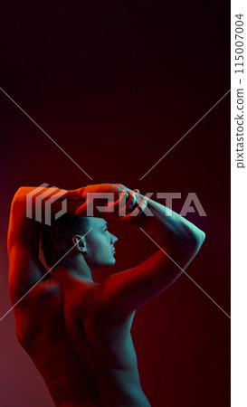 Poster. Rear view portrait of young man with athletic body raising hands in neon light against gradient background. Copy space 115007004