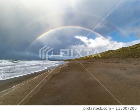 Beautiful rainbow at Portnoo Narin beach in County Donegal - Ireland Beautiful rainbow at Portnoo Narin beach in County Donegal - Ireland 115007206