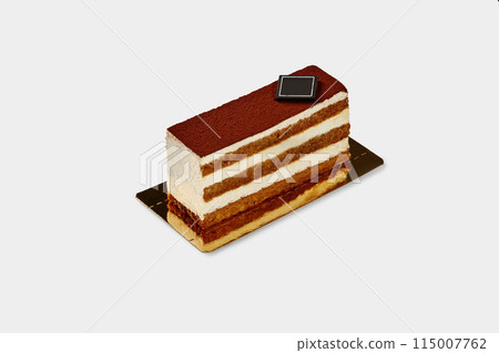 Slice of traditional Italian tiramisu cake on white backdrop 115007762