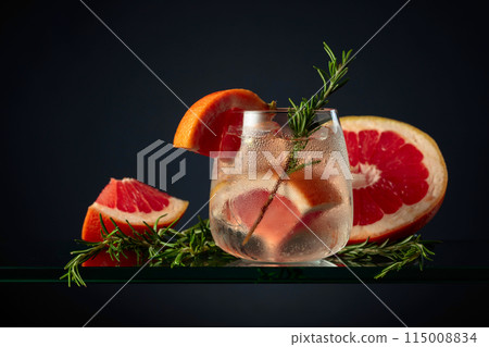 Cocktail gin tonic with ice, grapefruit, and rosemary. 115008834