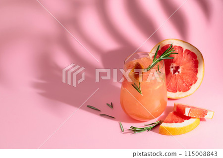 Summer cocktail with grapefruit, rosemary, and ice. 115008843