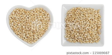 Sorghum seeds in ceramic bowl isolated on white background. Top view. Flat lay. 115009087