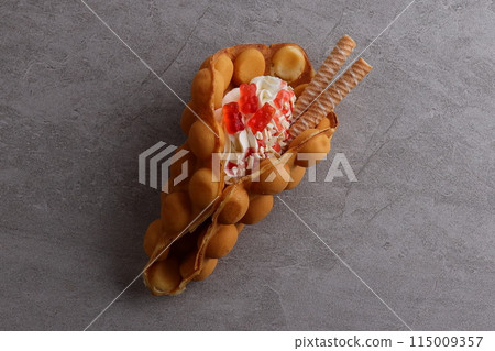 Delicious sweet bubble waffle on table 115009357