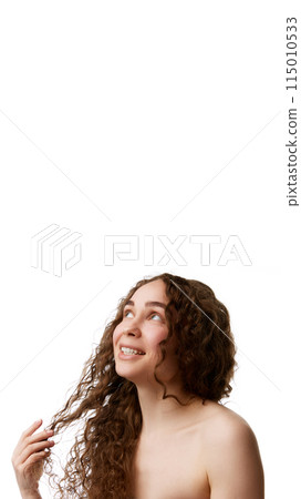 Vertical portrait of beautiful smiling woman with curly brown hair, spotless clear skin and bare shoulders isolated on white background Vertical portrait of beautiful smiling woman with curly brown hair, spotless clear skin and bare shoulders isolated on white background 115010533