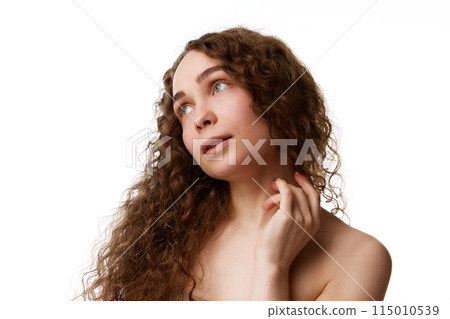 Purity and simplicity. Portrait of tender young woman with beautiful no makeup, spotless, smooth face isolated on white background Purity and simplicity. Portrait of tender young woman with beautiful no makeup, spotless, smooth face isolated on white background 115010539
