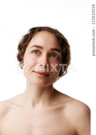 Tenderness and wellness. Young beautiful woman with flawless skin isolated on white background. Importance of good skincare routine 115010559