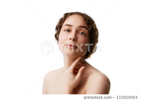 Bare Elegance. Portrait of young woman with curly hair and healthy skin with no makeup isolated on white background Bare Elegance. Portrait of young woman with curly hair and healthy skin with no makeup isolated on white background 115010563