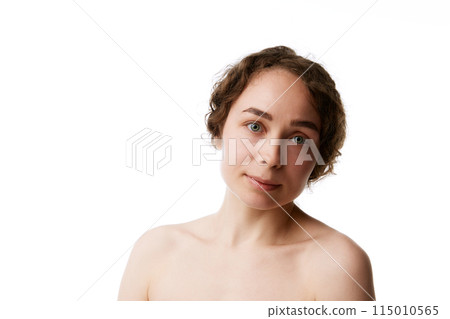 Portrait of young woman with natural no makeup face, clear spotless face, fresh and radiant complexion isolated on white background 115010565