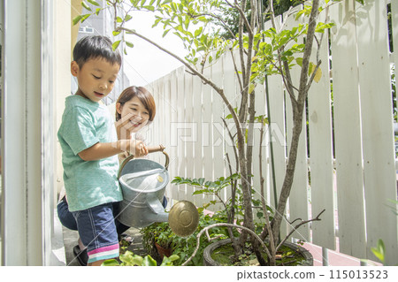 Watering plants with parents and children 115013523