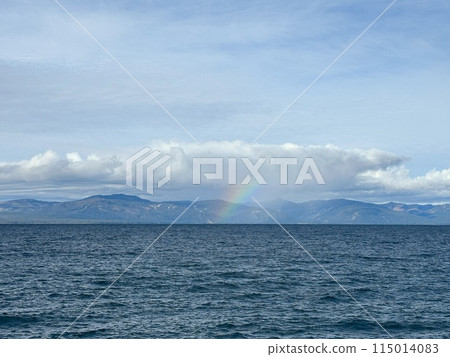 A rainbow over the lake after the rain 115014083