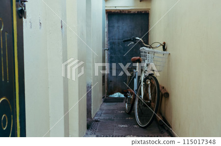 old bicycle on the street old bicycle on the street 115017348