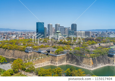 [Cityscape] Osaka Castle Park and the OBP buildings in spring [Osaka Castle Tower] 115017404