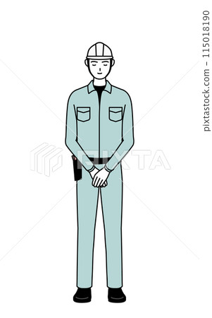 A man in a helmet and work clothes bowing with folded hands 115018190