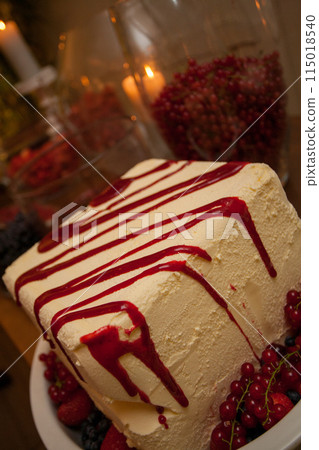 Square cake with red drizzle, berries is decadent, tempting, luxurious, ideal for special events Square cake with red drizzle, berries is decadent, tempting, luxurious, ideal for special events 115018540