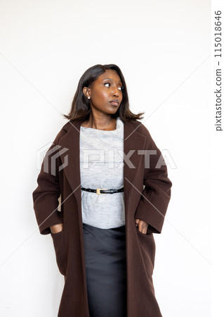 Portrait of Stylish Young Black Woman in Brown Coat 115018646