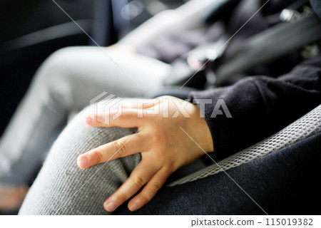 Infant sitting on a child seat 115019382
