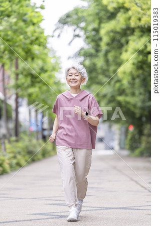 Senior woman walking Senior woman walking 115019383