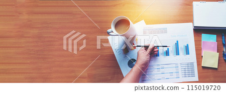 Banner woman working office desk reading financial report finance chart graph on table. Wide tax audit woman hands working paperwork office. Banner Businesswoman Audit financial with copy space Banner woman working office desk reading financial report finance chart graph on table. Wide tax audit woman hands working paperwork office. Banner Businesswoman Audit financial with copy space 115019720