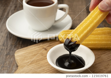 Churros, lifting, hand Churros, lifting, hand 115019761