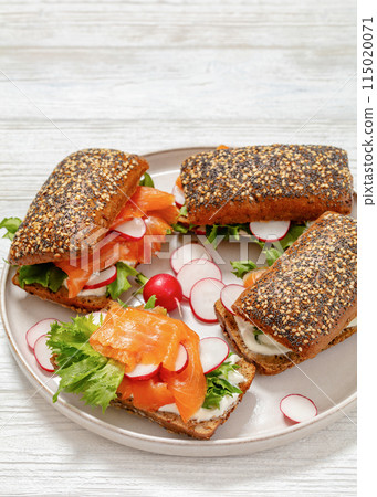 smoked salmon sandwiches on rye bread rolls smoked salmon sandwiches on rye bread rolls 115020071