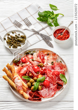 italian antipasto plate of cured meat and veggies italian antipasto plate of cured meat and veggies 115020072