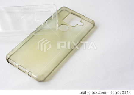 A new, beautiful smartphone case and a smartphone case that has yellowed due to aging A new, beautiful smartphone case and a smartphone case that has yellowed due to aging 115020344