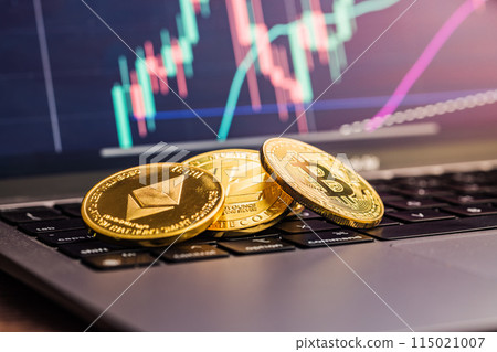 Bitcoin, litecoin and ethereum. Cryptocurrency on computer a keyboard and business chart on screen on background. Bitcoin, litecoin and ethereum. Cryptocurrency on computer a keyboard and business chart on screen on background. 115021007