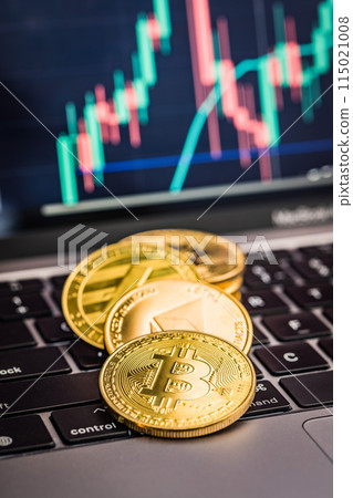 Bitcoin, litecoin and ethereum. Cryptocurrency on computer a keyboard and business chart on screen on background. 115021008