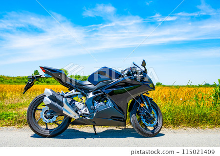 Early summer motorcycle touring, wheat fields and blue skies, a-2 vivid color 115021409