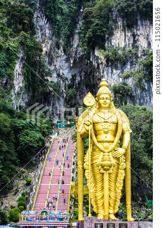 Murugan the Hindu God of war and victory. This statue of Murugan can be found at the Batu caves in Kuala Lumpur. Square on view showing the intricate detail. 115021656