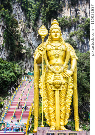 Murugan the Hindu God of war and victory. This statue of Murugan can be found at the Batu caves in Kuala Lumpur. Square on view showing the intricate detail. 115021657