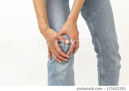 The hands of a woman who is concerned about her knees The hands of a woman who is concerned about her knees 115022261