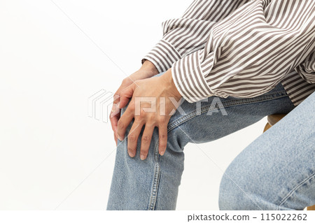 The hands of a woman who is concerned about her knees The hands of a woman who is concerned about her knees 115022262