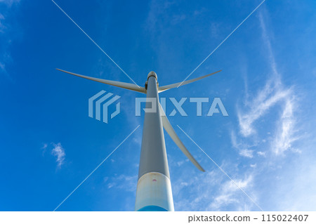 Wind turbines, blue sky and white clouds close-up Wind turbines, blue sky and white clouds close-up 115022407