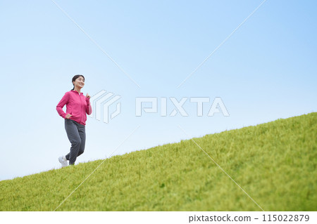 Middle-aged woman running in sportswear Middle-aged woman running in sportswear 115022879