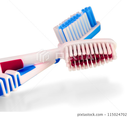 Two toothbrushes isolated on white background Two toothbrushes isolated on white background 115024702