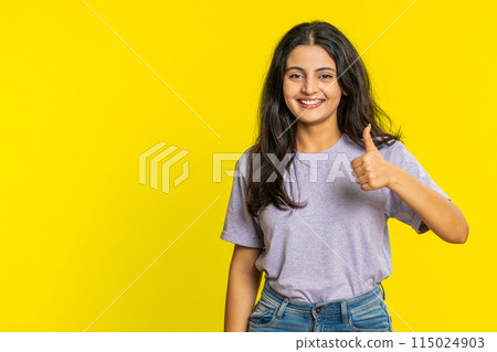 Indian woman raises thumbs up agrees or gives positive reply recommends advertisement like good idea Indian woman raises thumbs up agrees or gives positive reply recommends advertisement like good idea 115024903