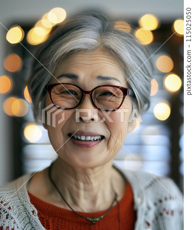 Joyful senior woman with sparkling background 115025050