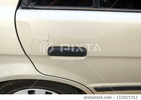 Car's door surface cracked. Car's door surface cracked. 115025352