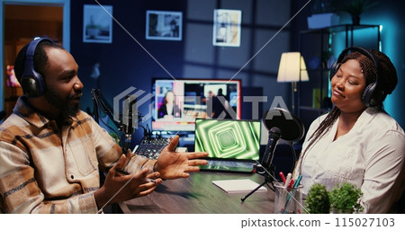 African american host engaging in entertaining discussion with celebrity during live stream in professional studio, making her laugh. Presenter uses high quality equipment to produce comedy podcast African american host engaging in entertaining discussion with celebrity during live stream in professional studio, making her laugh. Presenter uses high quality equipment to produce comedy podcast 115027103