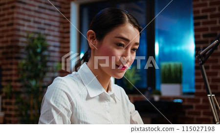 Businesswoman planning marketing project on laptop late at night, using sales statistics on charts. Office employee working on strategy research to create financial development, camera A Businesswoman planning marketing project on laptop late at night, using sales statistics on charts. Office employee working on strategy research to create financial development, camera A 115027198